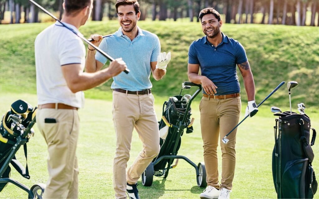 multi ethnic group of young men talking on a golf field